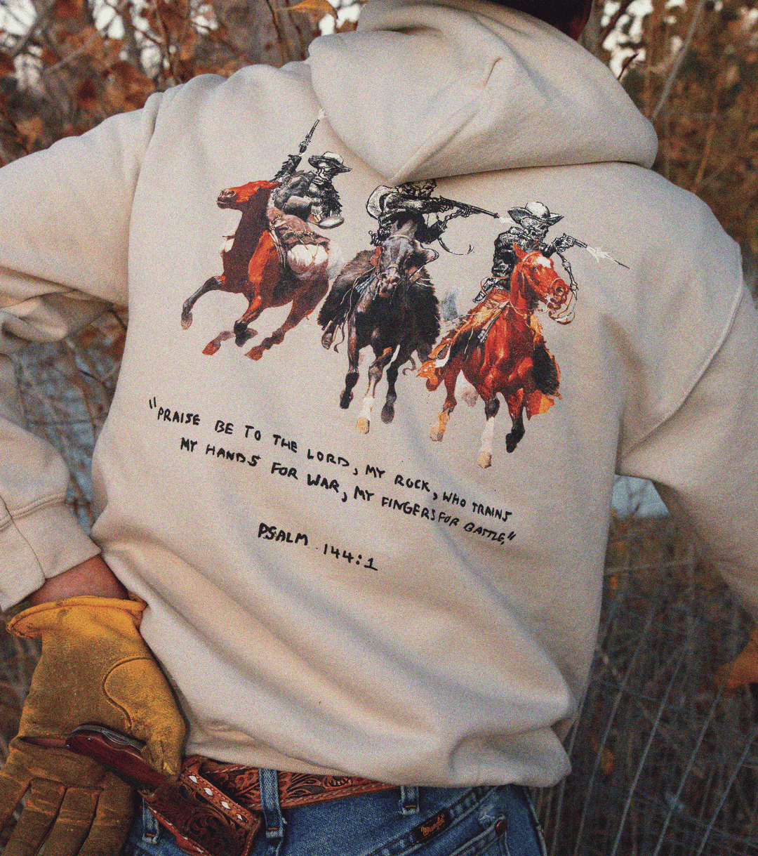 Psalm 144:1 Mid-Weight Hoodie- A Christian piece of apparel featuring a design of a skeleton cowboy and Bible verse