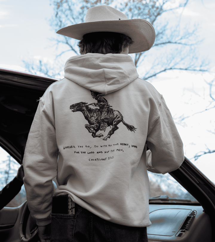 Colossians 3:23 Mid-Weight Hoodie- A Christian piece of apparel featuring a design of a skeleton cowboy and Bible verse
