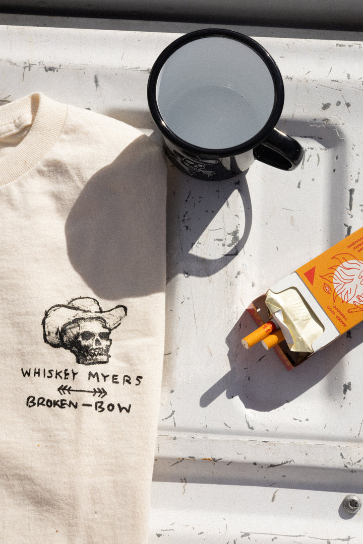 Whiskey Myers x Broken Bow: Broken Window Serenade- A official t-shirt for the song "Broken Window Serenade" by Whiskey Myers that features a design of a skeleton sitting underneath a tree with the words "I loved you so"